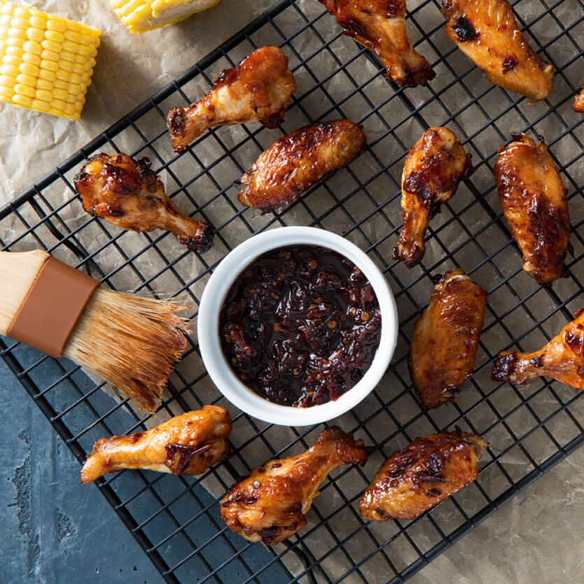 An image of prepared Air-Fried chicken Wings with Chipotle Sauce made with Pacific Foods® Organic Free Range Chicken Broth, honey, chipotle peppers, chicken wings, celery and carrots.