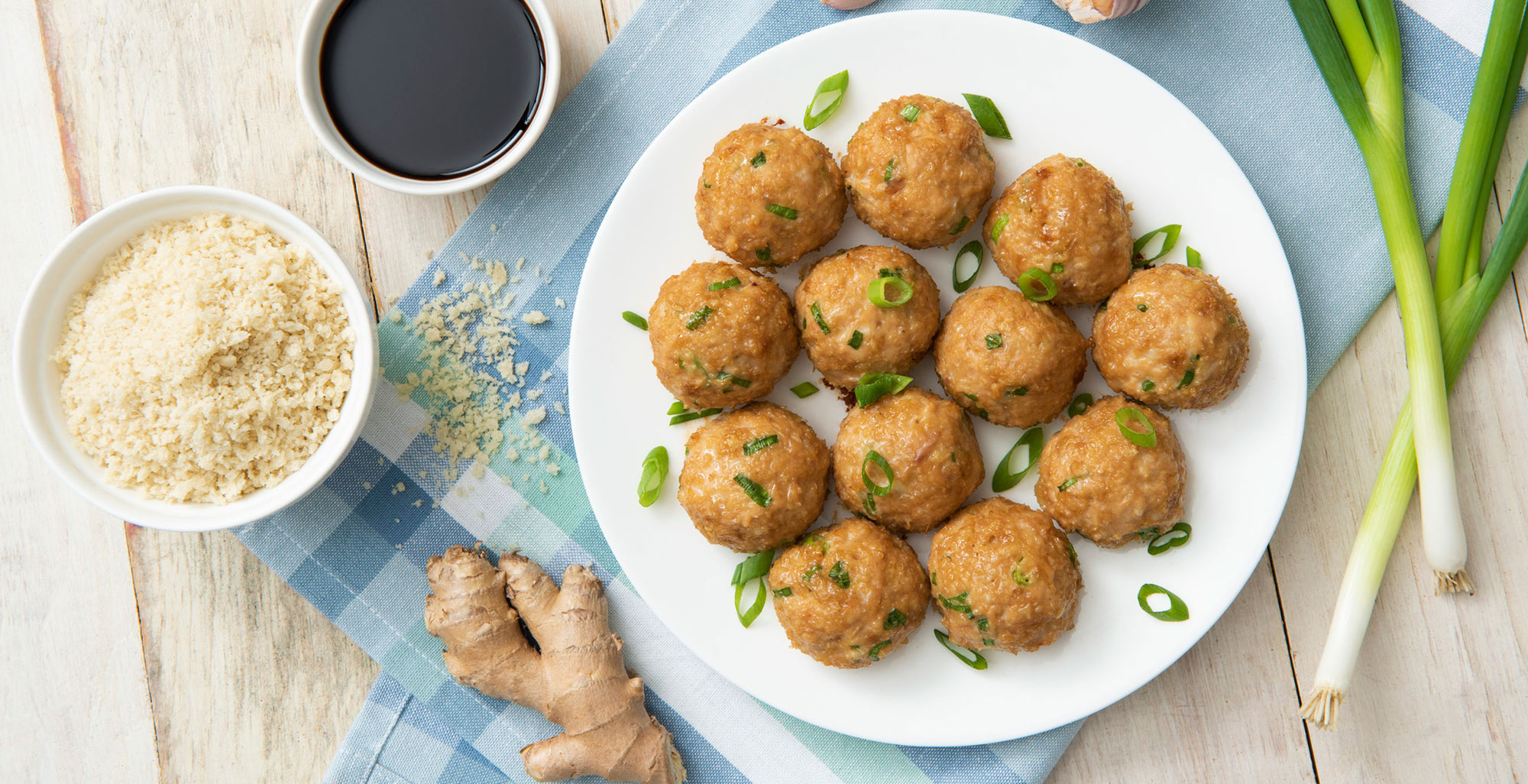 An image of prepared Air-Fryer Asian Meatballs made with ground chicken, Pacific Foods® Organic Low Sodium Chicken Broth, soy sauce, ginger and garlic.