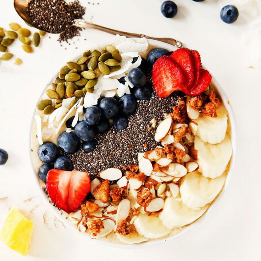 An image of prepared Banana Mango Smoothie Bowl made with Pacific Foods® Organic Coconut Unsweetened Original Beverage, mango, banana and chia seeds.