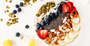 An image of prepared Banana Mango Smoothie Bowl made with Pacific Foods® Organic Coconut Unsweetened Original Beverage, mango, banana and chia seeds.