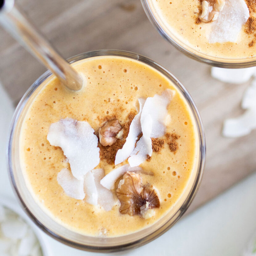 An image of prepared Carrot Cake Smoothie made with Pacific Foods® Organic Unsweetened Almond Beverage, carrot, banana, pineapple, coconut, almond butter, hemp seeds and walnuts.