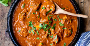 An image of prepared Chicken Tikka Masala made with Pacific Foods® Organic Free Range Low Sodium Chicken Broth, Pacific Foods® Organic Coconut Unsweetened Plant-Based Beverage, cilantro, tomato, ginger, garam masala and chicken.