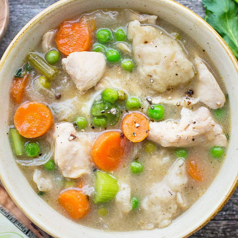 An image of prepared Classic Chicken and Dumplings made with chicken, carrots, onions, peas, Pacific Foods® Organic Cream of Chicken Soup, Pacific Foods® Organic Free Range Chicken Broth and milk.