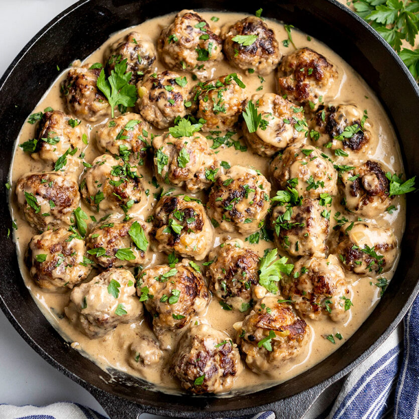 An image of prepared Classic Swedish Meatballs made with ground beef, ground pork, Pacific Foods® Organic Beef Broth, half and half and parsley.