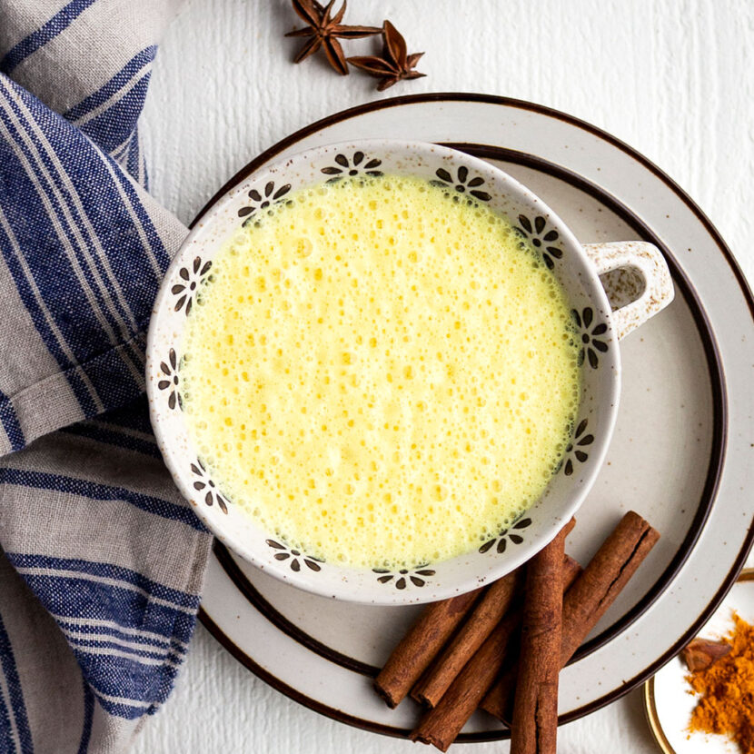An image of prepared Coconut Turmeric Latte made with Pacific Foods® Organic Coconut Unsweetened Plant-Based Beverage, turmeric, cinnamon and honey.