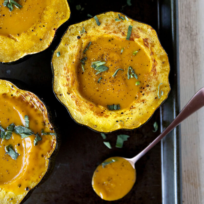 An image of prepared Cozy Winter Squash Soup made with pumpkin or acorn squash, butternut squash, sage, Pacific Foods® Organic Vegetable Broth and Pacific Foods® Organic Creamy Butternut Squash Soup.