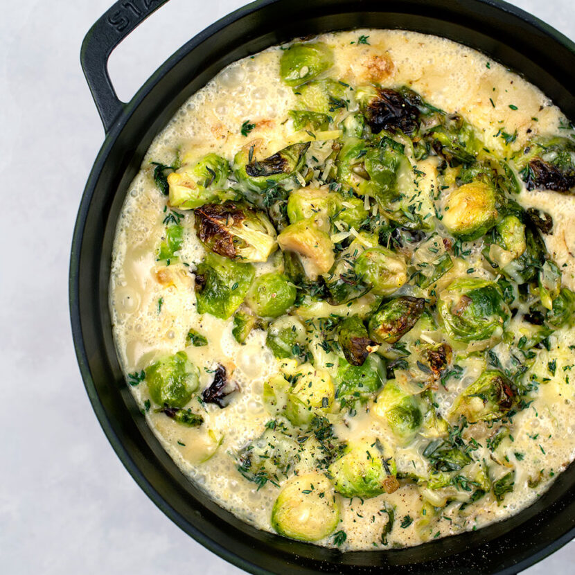 An image of prepared Creamy Brussels Sprouts Bake made with Brussels sprouts, Pacific Foods® Organic Cream of Mushroom Condensed Soup, creamy and Gruyére cheese.