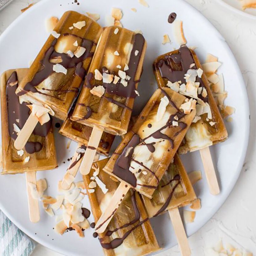 An image of prepared Dairy-Free Toasted Coconut Cold Brew Pops made with Pacific Foods® Organic Coconut Unsweetened Original Beverage, cold brew coffee, yogurt, coconut and cocoa powder.