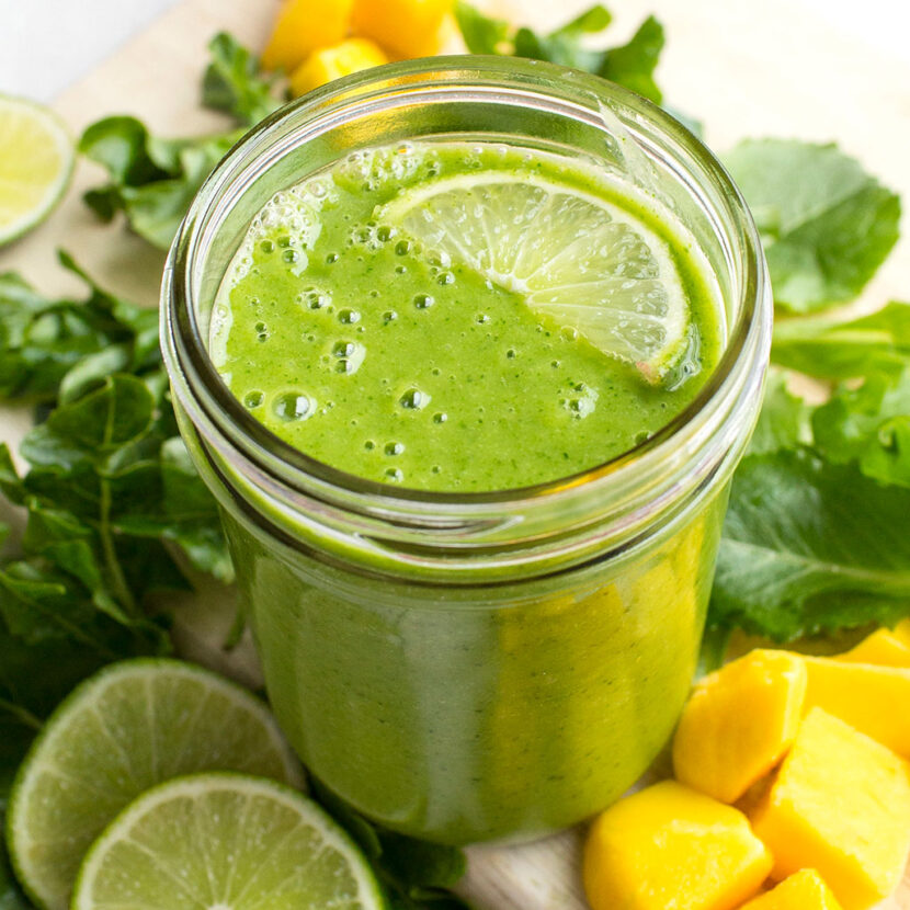 An image of prepared Dairy- Free Tropical Mango Green Smoothie made with banana, mixed salad greens, Pacific Foods® Organic Oat Original Beverage, pineapple, mango and lime juice.