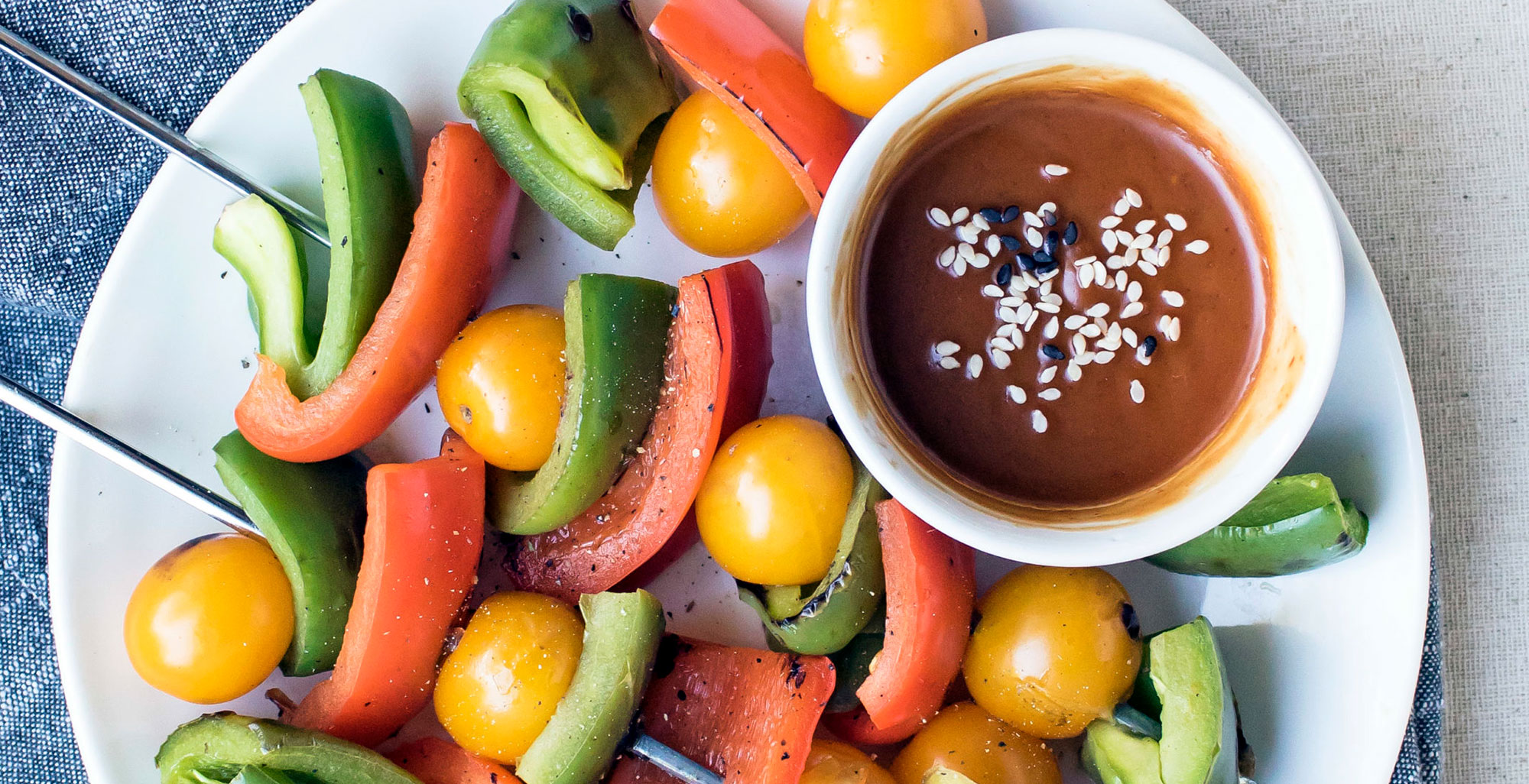 An image of prepared Five Minute Peanut Sauce made with Pacific Foods® Organic Coconut Unsweetened Original Beverage, peanut butter, soy sauce, honey, lime juice and sesame seeds.