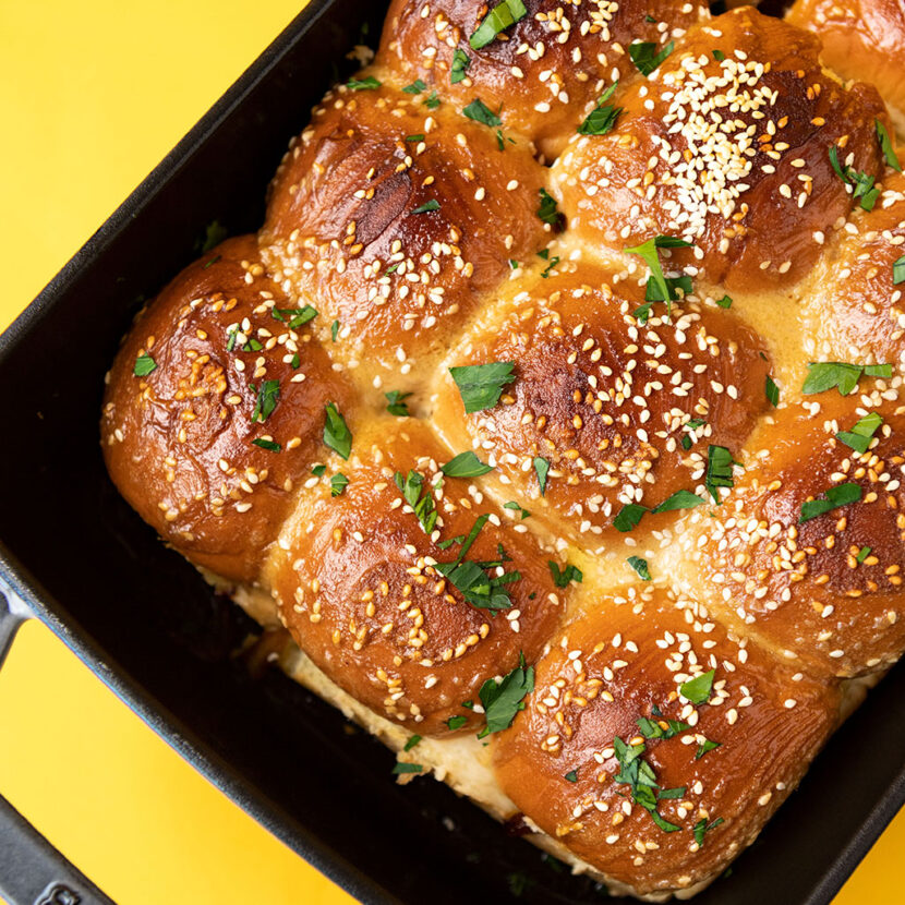 An image of prepared French Dip Sliders with Au Jus Sauce made with slider buns, deli style roast beef, provolone and Pacific Foods® Organic Beef Broth.