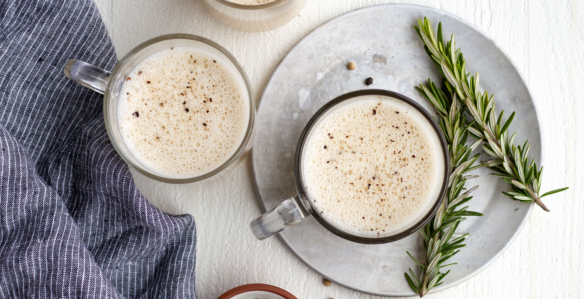 An image of prepared Garlic and Rosemary Fatty Bone Broth made with Pacific Foods® Organic Beef Bone Broth, garlic, rosemary and butter.