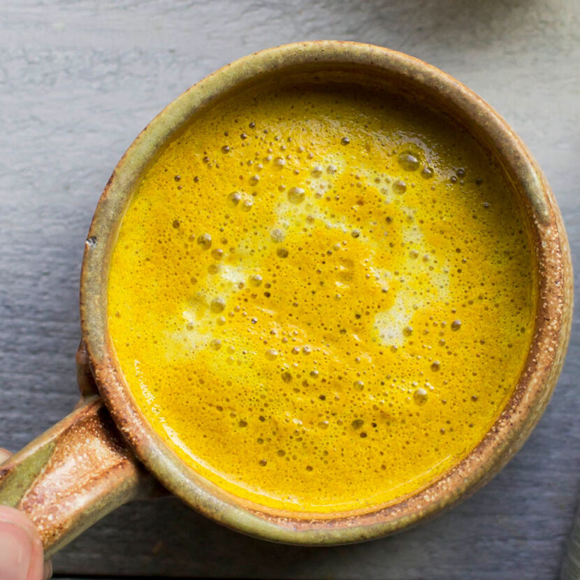 An image of prepared Golden Milk Tea Latte made with Pacific Foods® Organic Oat Milk Beverage, coconut sugar, cinnamon, ginger and turmeric.