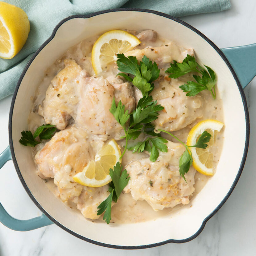 An image of prepared Greek Lemon Chicken made with chicken, Pacific Foods® Organic Cream of Chicken Condensed Soup, bell pepper, tomato, cucumber, kalamata olives, red onion and feta cheese.