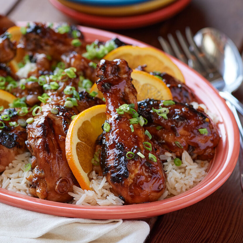 An image of prepared Hawaiian Grilled Huli Huli Chicken and Rice made with chicken drumsticks, pineapple juice, Pacific Foods® Organic Free Range Chicken Broth and ginger.