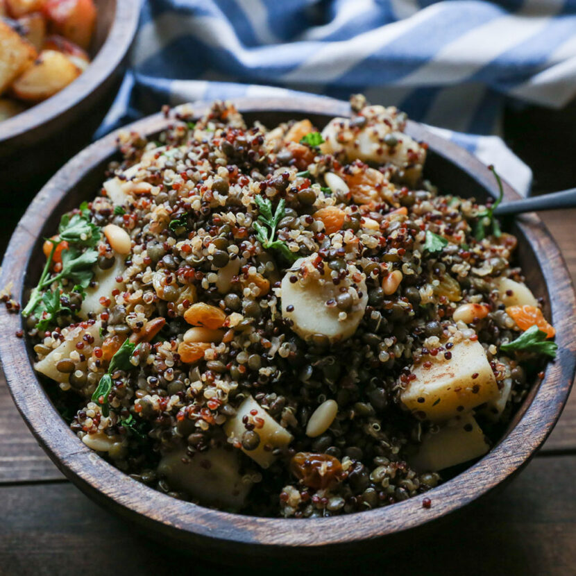 An image of prepared Indian-Spiced Lentil and Quinoa Stuffing made with lentils, tri-color quinoa, Pacific Foods® Organic Unsalted Chicken Stock, parsnips, golden raisins, pine nuts, parsley and spices.