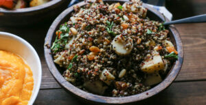 An image of prepared Indian-Spiced Lentil and Quinoa Stuffing made with lentils, tri-color quinoa, Pacific Foods® Organic Unsalted Chicken Stock, parsnips, golden raisins, pine nuts, parsley and spices.