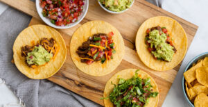 An image of prepared Instant Pot® Pulled Beef Tacos made with beef chuck roast, Pacific Foods® Low Sodium Organic Beef Broth and tortillas.