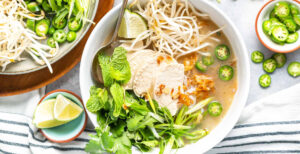 An image of prepared Keto Vietnamese Chicken Noodle Soup made with Pacific Foods® Organic Unsalted Chicken Bone Broth, chicken, shirataki noodles, bean sprouts and cilantro.