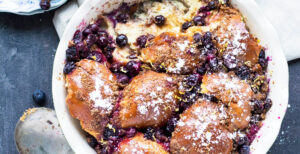 An image of prepared Lemon Blueberry Baked French Toast made with challah bread, blueberries, eggs, Pacific Foods® Organic Almond Original Beverage, cinnamon and maple syrup.