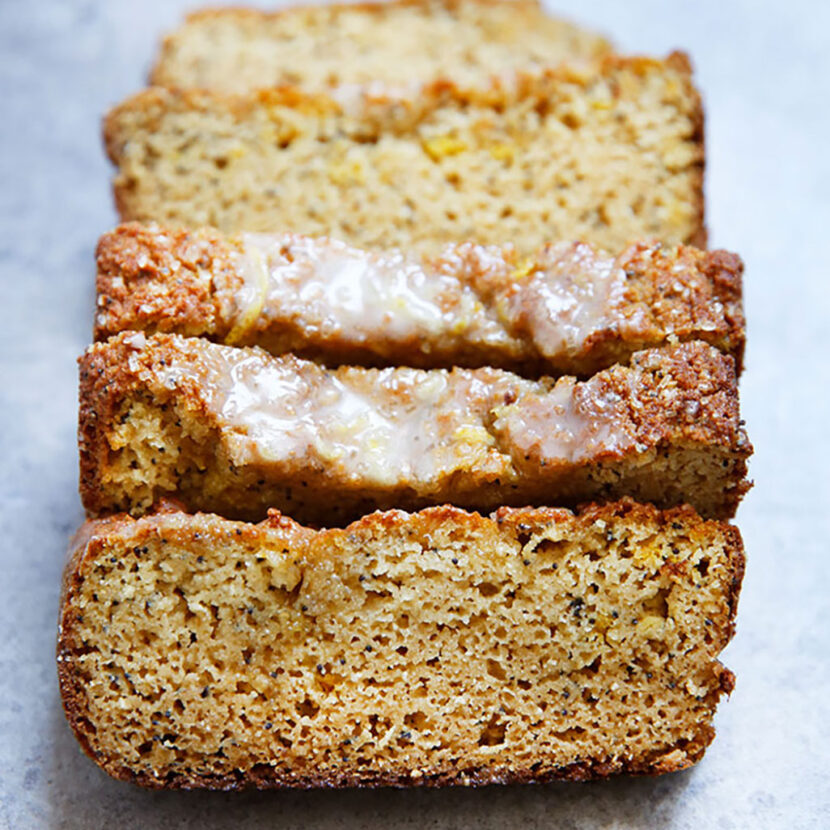 An image of prepared Lemon Poppy Seed Loaf with Vanilla Lemon Glaze made with Pacific Foods® Organic Almond Original Beverage, almond flour, coconut flour, applesauce, maple syrup, lemon and poppy seeds.