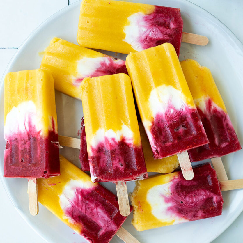 An image of prepared Raspberry Mango Coco Pops made with Pacific Foods® Organic Coconut Original Beverage, mango, raspberries and yogurt.