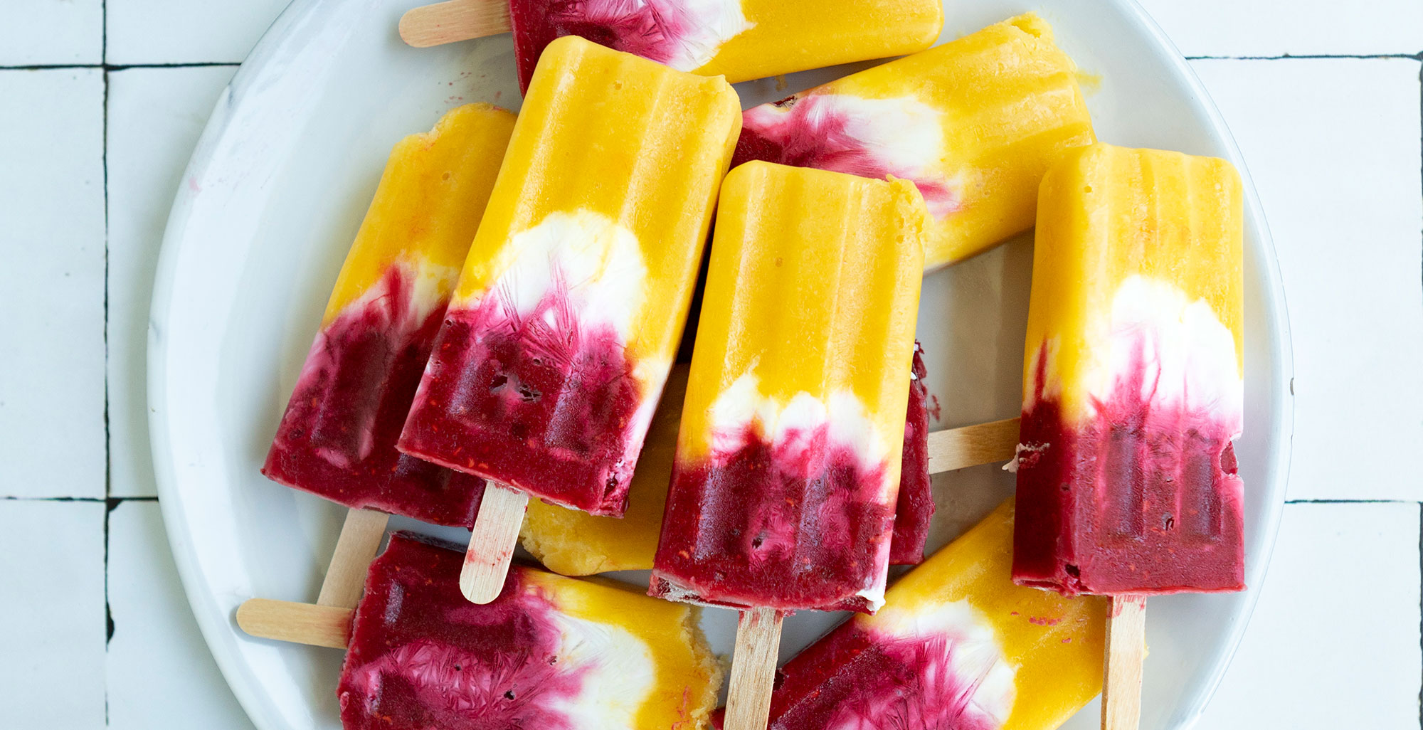 An image of prepared Raspberry Mango Coco Pops made with Pacific Foods® Organic Coconut Original Beverage, mango, raspberries and yogurt.