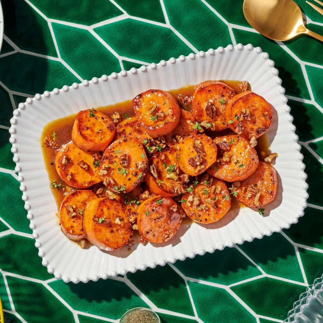 An image of prepared Melting Sweet Potatoes made with butter, pecans, maple syrup, sweet potatoes and Pacific Foods® Organic Free Range Chicken Broth.