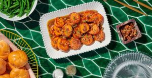 An image of prepared Melting Sweet Potatoes made with butter, pecans, maple syrup, sweet potatoes and Pacific Foods® Organic Free Range Chicken Broth.