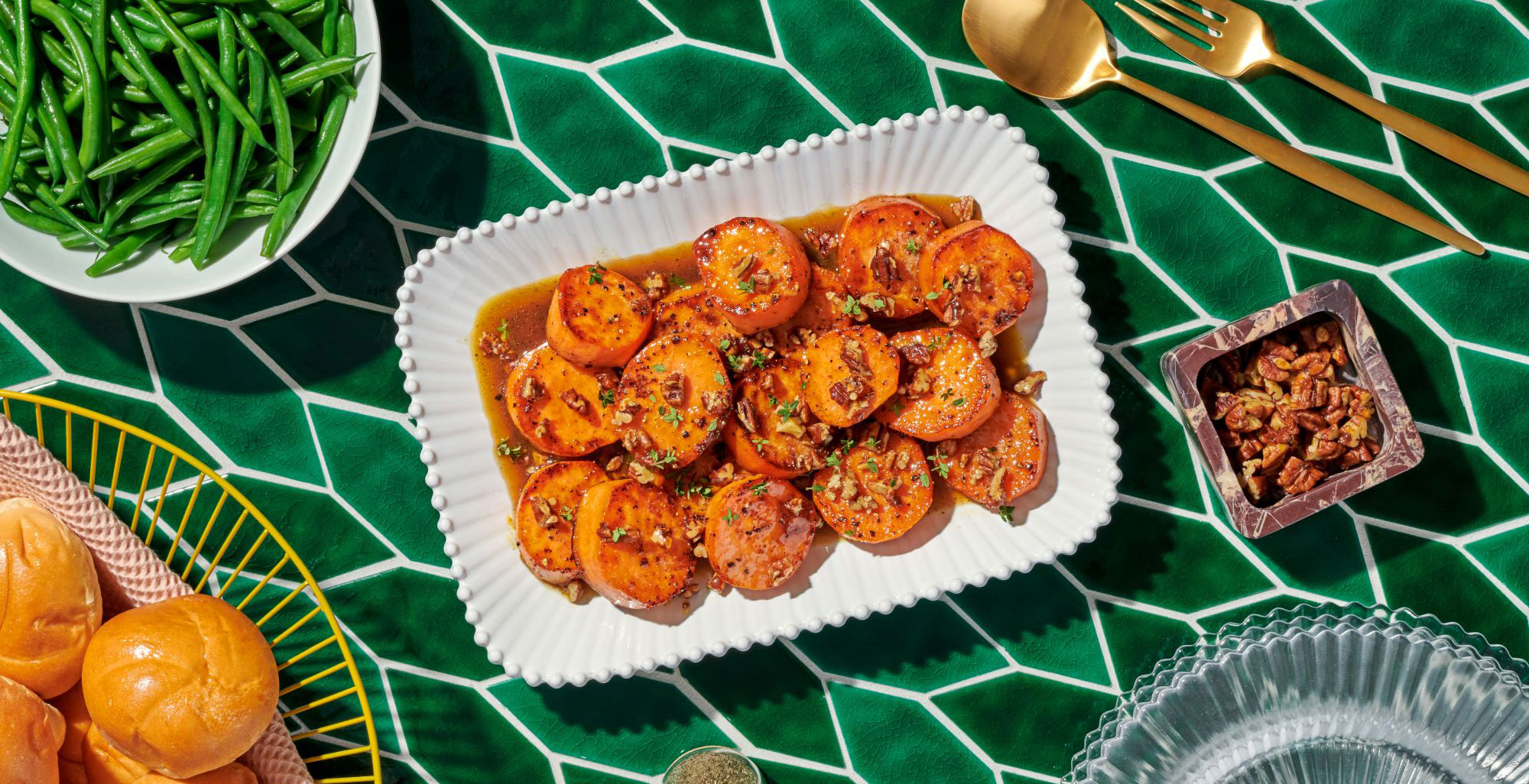 An image of prepared Melting Sweet Potatoes made with butter, pecans, maple syrup, sweet potatoes and Pacific Foods® Organic Free Range Chicken Broth.