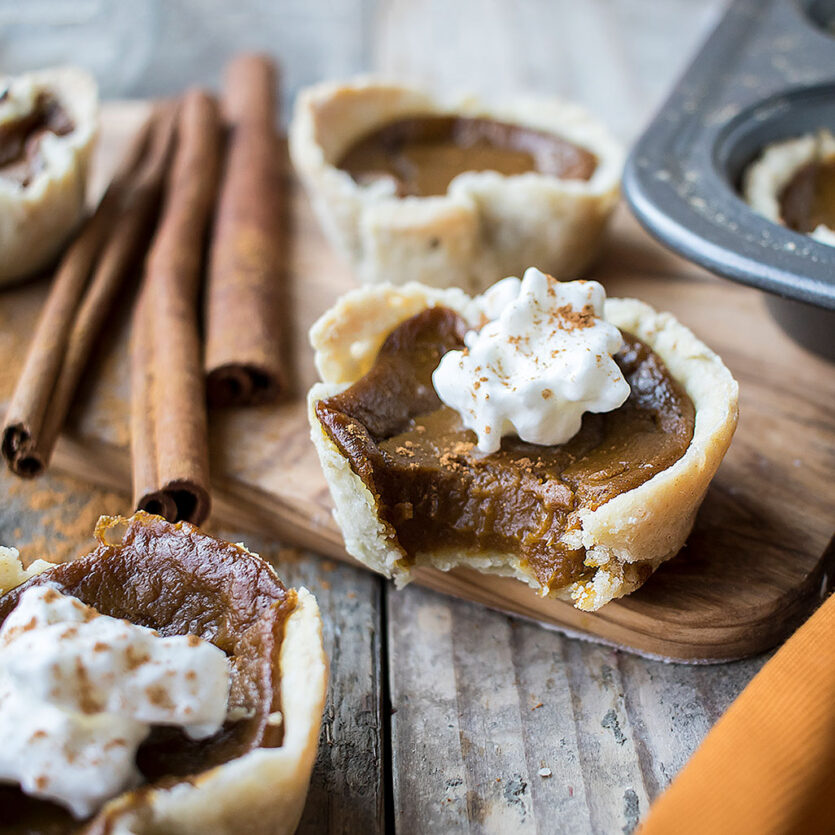An image of prepared Mini Maple Pumpkin Pies made with pumpkin, maple-flavored syrup, Pacific Foods™ Organic Coconut Unsweetened Plant-Based Beverage and coconut oil.