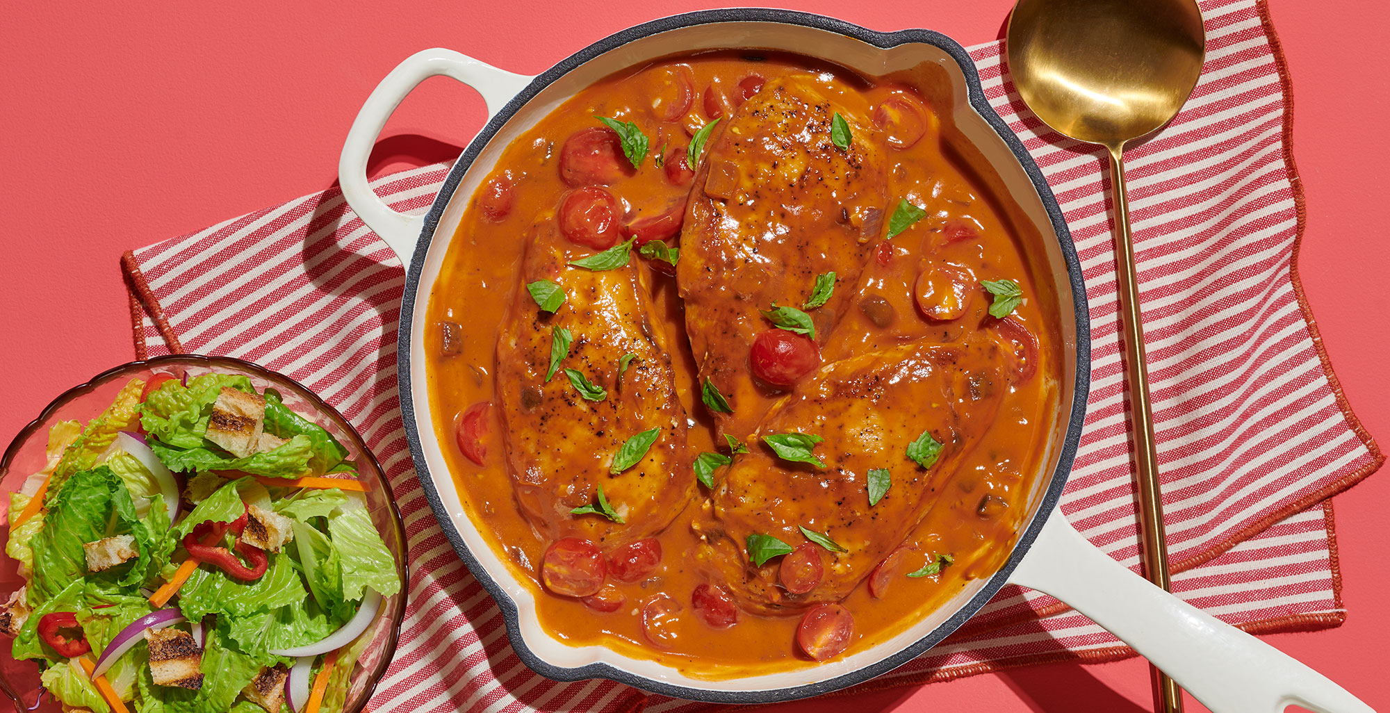 An image of prepared One-Skillet Roasted Red Pepper Chicken made with chicken, Pacific Foods® Organic Roasted Red Pepper & Tomato Soup, red onion, basil, olive oil and cherry tomatoes.