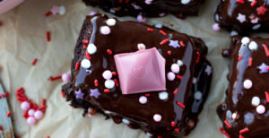 An image of prepared Plant-Based Brownies with Chocolate Almond Ganache made with Pacific Foods® Almond Vanilla Beverage and chocolate chips.