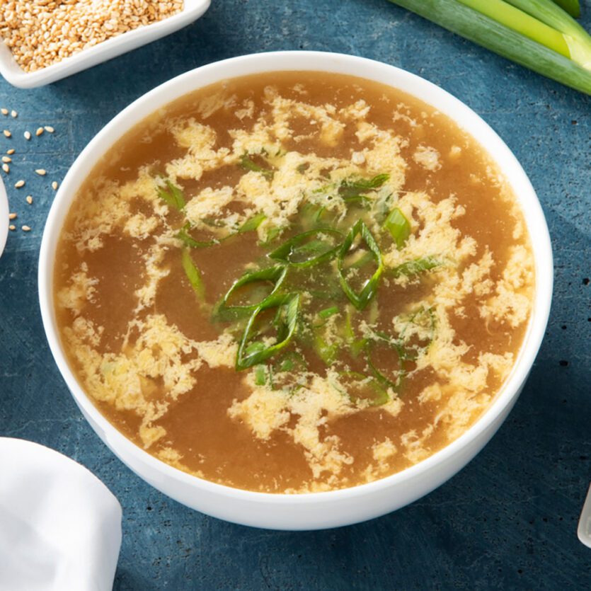 An image of prepared Quick and Easy Egg Drop Soup made with Pacific Foods® Organic Chicken Stock, ginger root, sesame oil and eggs.
