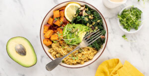 An image of prepared Quinoa Grain Bowl with Mushrooms, Sweet Potato and Kale made with Pacific Foods® Organic Low Sodium Vegetable Broth, Pacific Foods® Organic Cream of Mushroom Condensed Soup, avocado, sweet potato, quinoa, shiitake mushrooms, kale, pumpkin seeds and tahini paste.