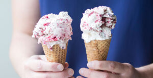An image of prepared Raspberry Fudge Swirl Coconut Ice Cream made with raspberries, chocolate chips, Pacific Foods® Organic Coconut Original Beverage, unsweetened coconut cream and sugar.