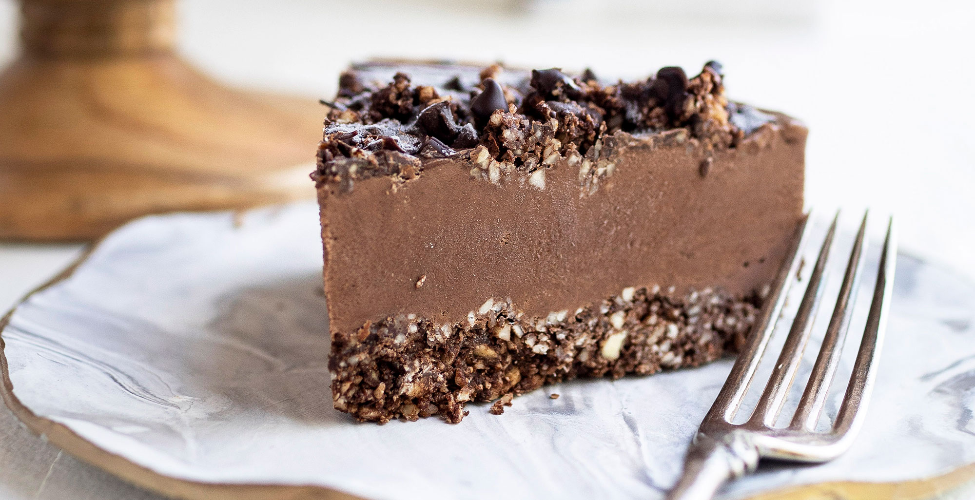 An image of prepared Raw Vegan Chocolate Tart made with cashews, almonds, chocolate, medjool dates and Pacific Foods® Organic Oat Original Beverage.