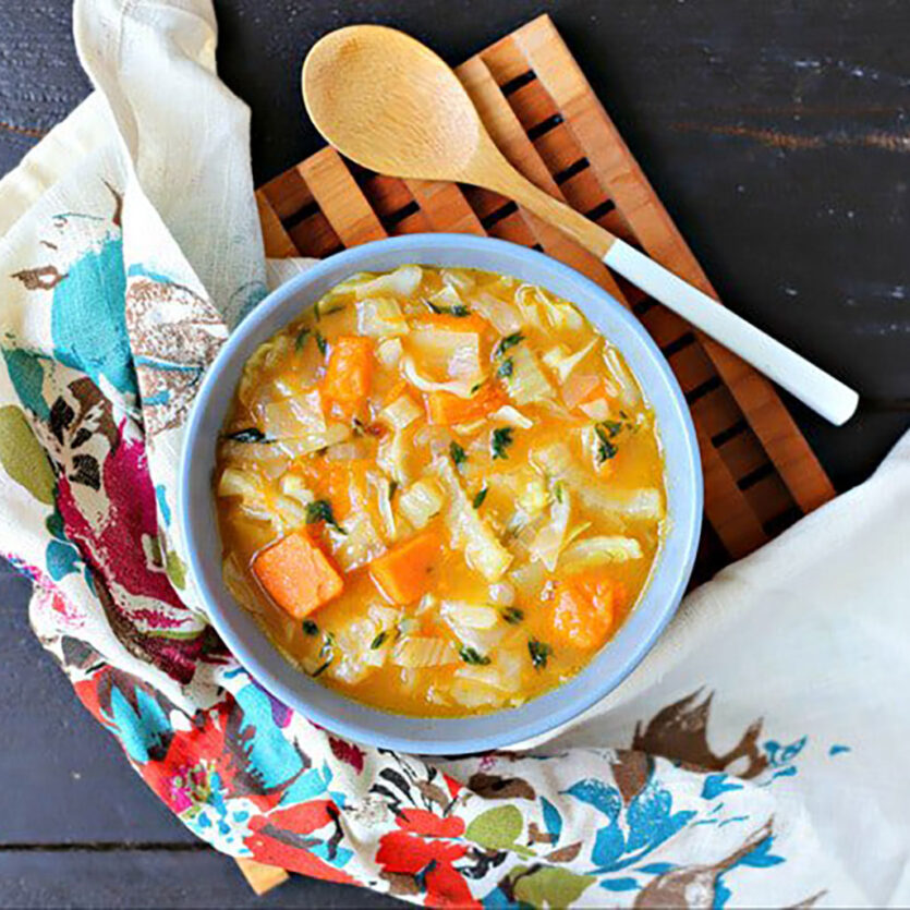 An image of prepared Roasted Vegetable Soup with Cabbage made with sweet potato, fennel, onion, green cabbage, Pacific Foods® Organic Low Sodium Vegetable Broth and thyme.