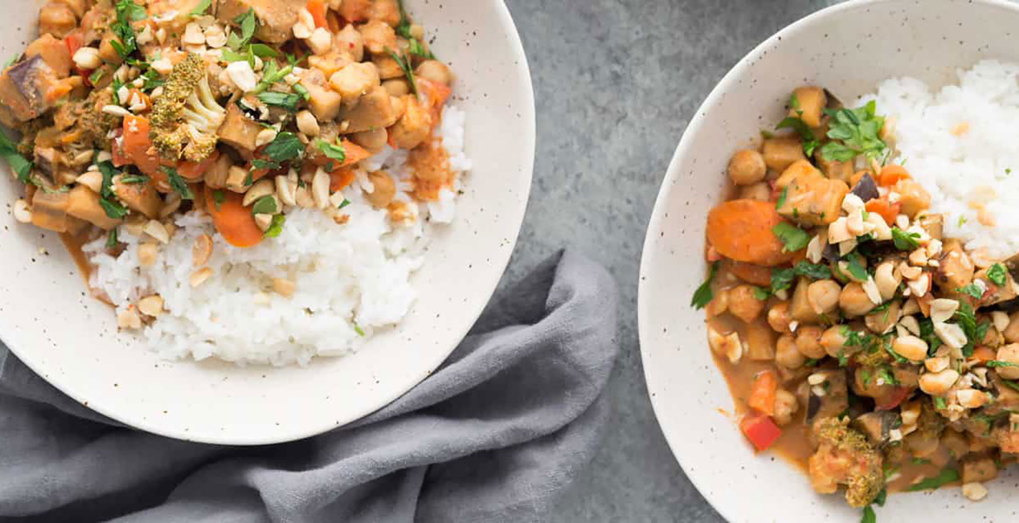 An image of prepared Slow Cooker Coconut Curry made with bell pepper, eggplant, Pacific Foods® Organic Coconut Original Beverage, peanut butter, broccoli and chickpeas.