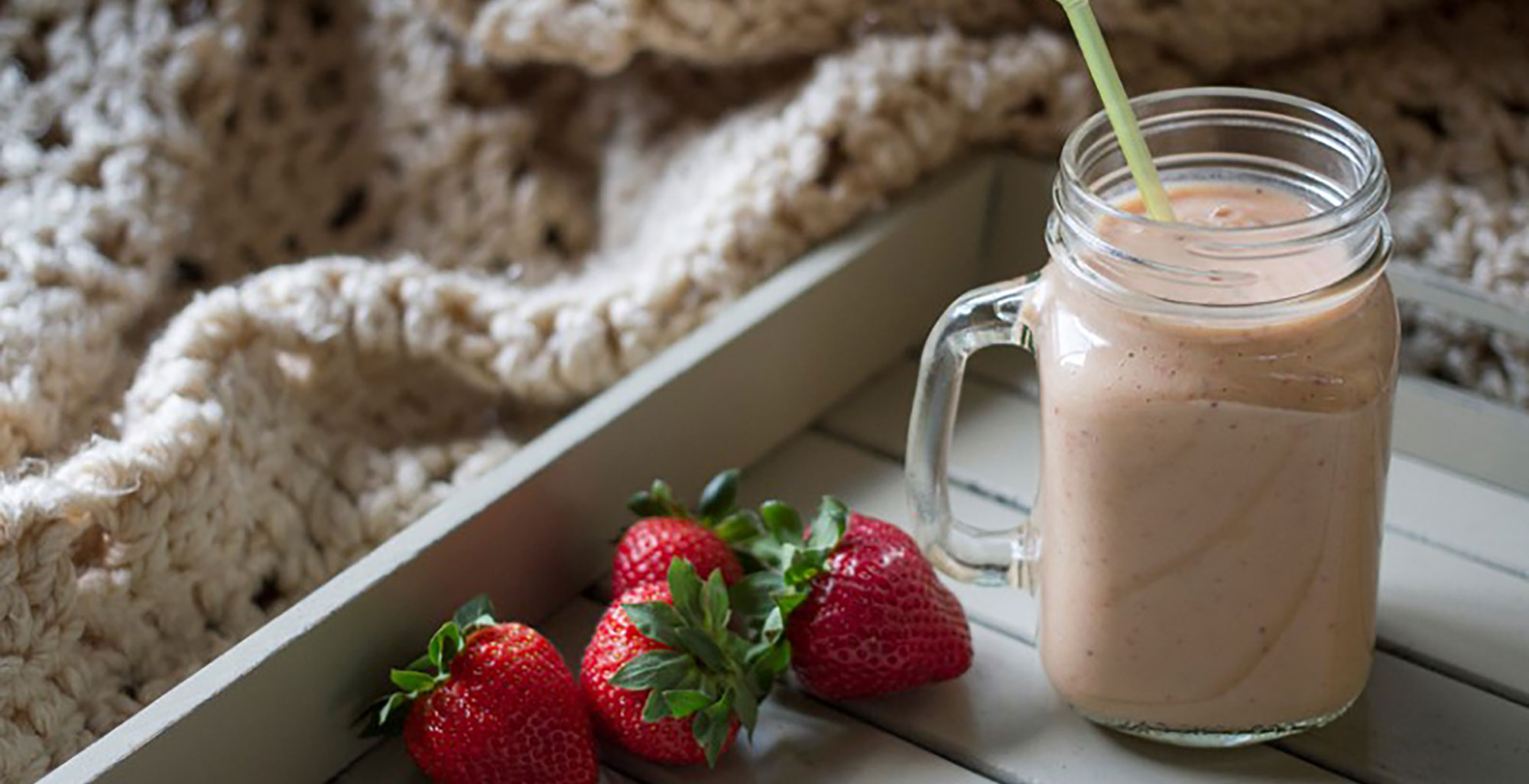 An image of prepared Strawberry Mango Ginger Smoothie made with Pacific Foods® Hemp Vanilla Beverage, strawberries, mango, ice and ginger.