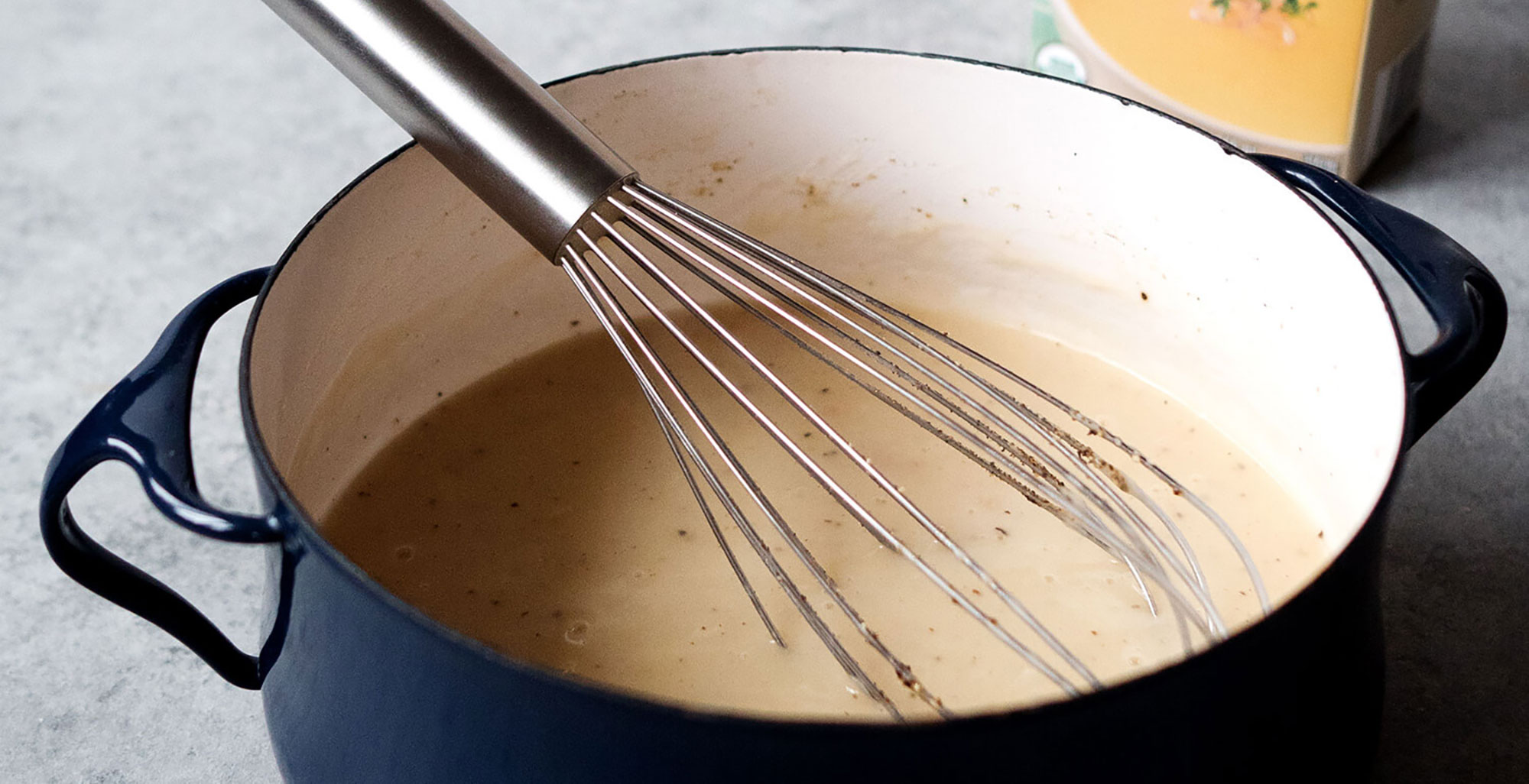 An image of prepared Traditional Turkey Gravy made with butter, shallot, flour, Pacific Foods® Organic Turkey Broth, salt and pepper.