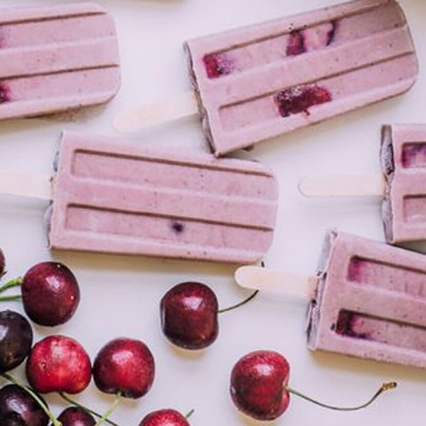 An image of prepared Vegan Cherry Almond Ice Cream Pops made with coconut milk, Pacific Foods® Organic Almond Original Beverage, banana, cashew butter, cherries and dates.