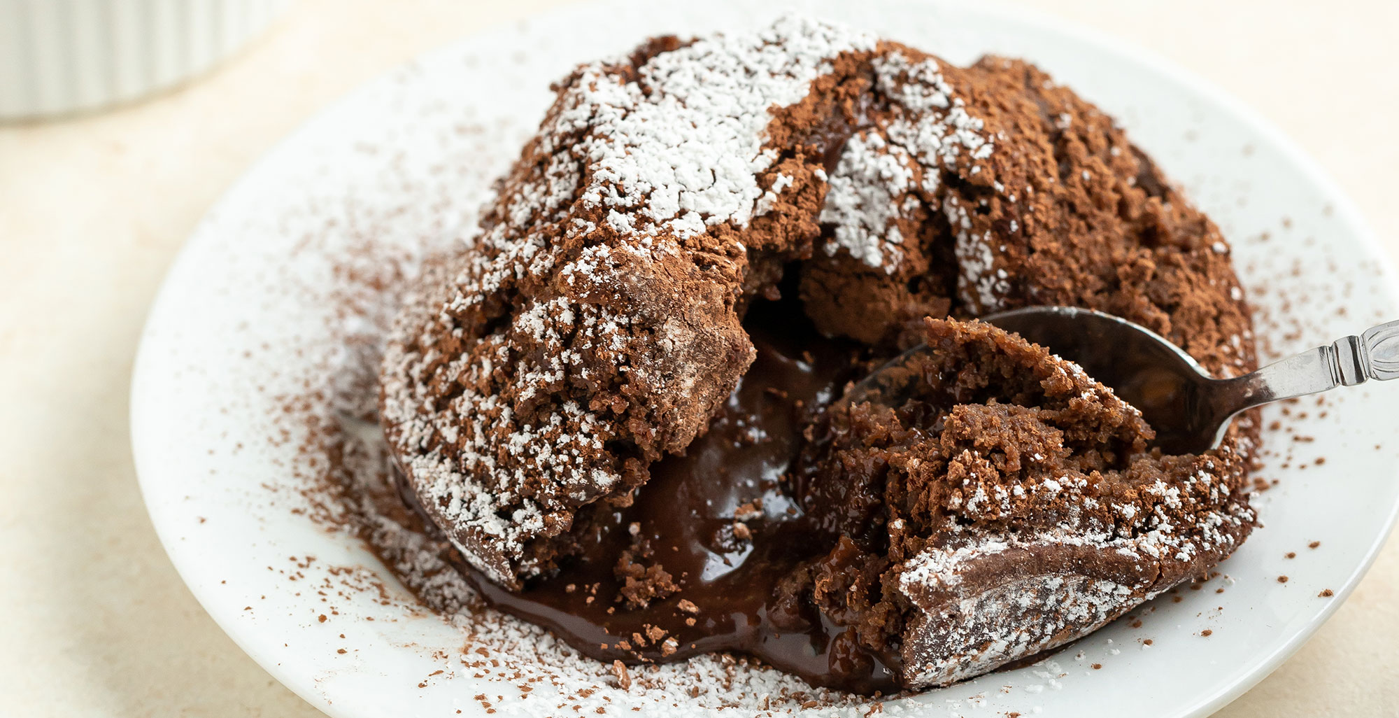 An image of prepared Vegan, Gluten-Free Chocolate Lava Cake made with chocolate chips, Pacific Foods® Organic Oat Original Beverage, oats, almond flour, cocoa powder and banana.