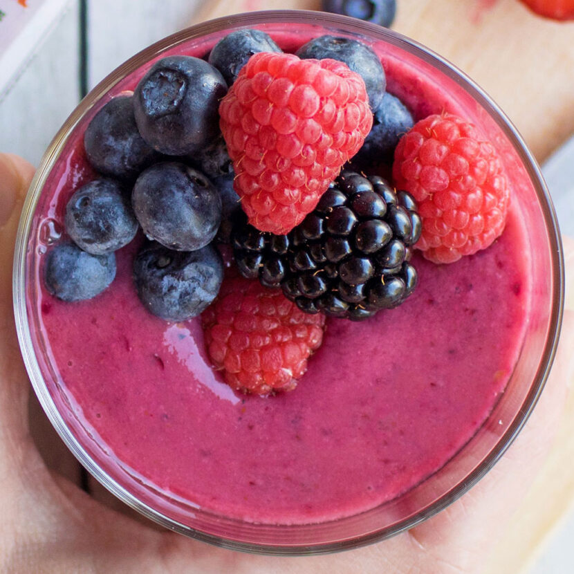 An image of prepared Very Berry Smoothie made with banana, Pacific Foods® Organic Almond Beverage and mixed berries.