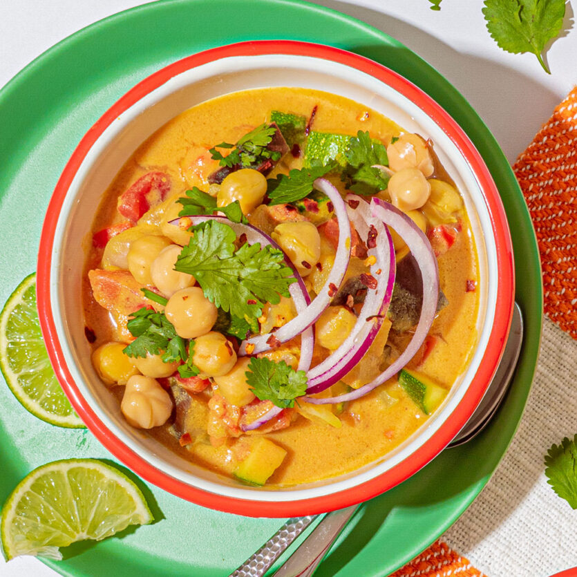 An image of prepared Vegetable & Chickpea Curry made with eggplant, onion, pepper, zucchini, turmeric, Pacific Foods® Organic Vegetable Broth, chickpeas and coconut milk.