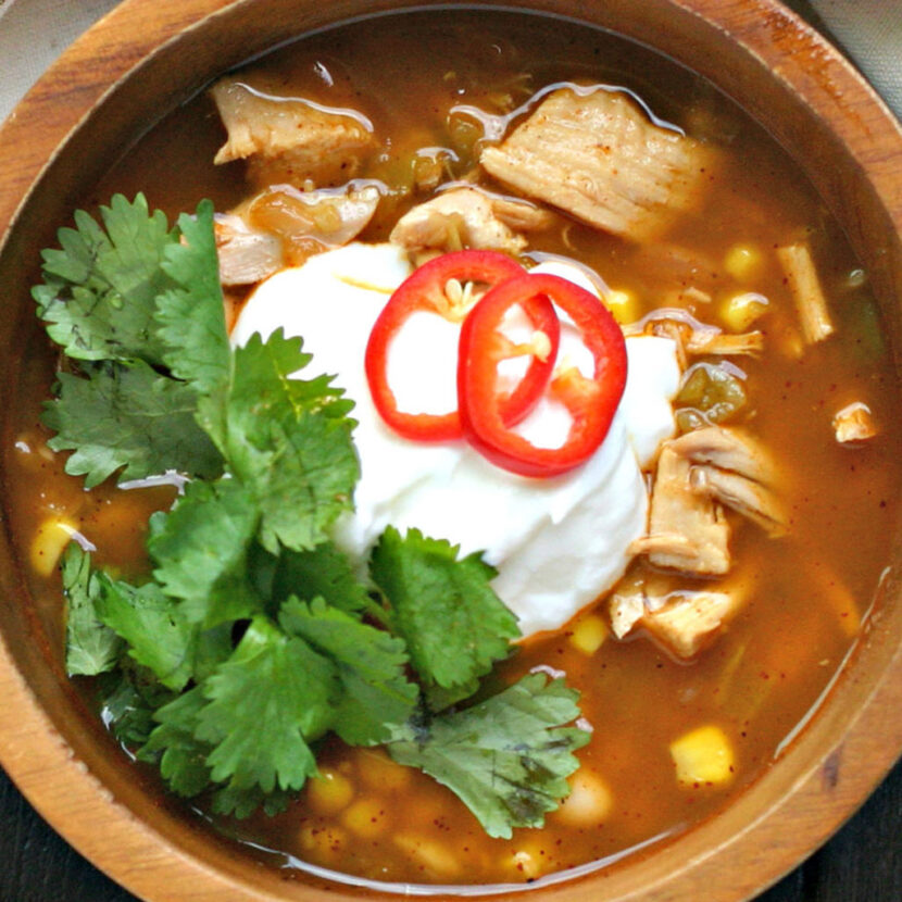 An image of prepared White Turkey Chili with Corn made with onion, green chilies, white beans, Pacific Foods® Organic Turkey Broth, turkey and corn.