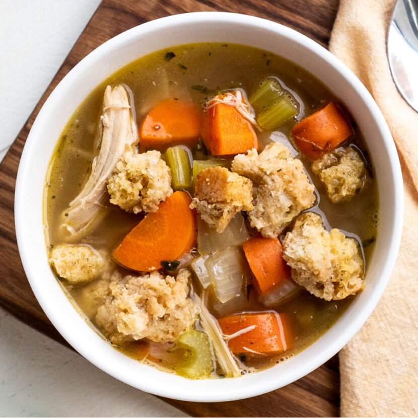 An image of prepared Gratefully Garlic Turkey Soup over Stuffing made with carrots, leftover turkey, leftover stuffing and Pacific Foods® Organic Low Sodium Chicken Broth.