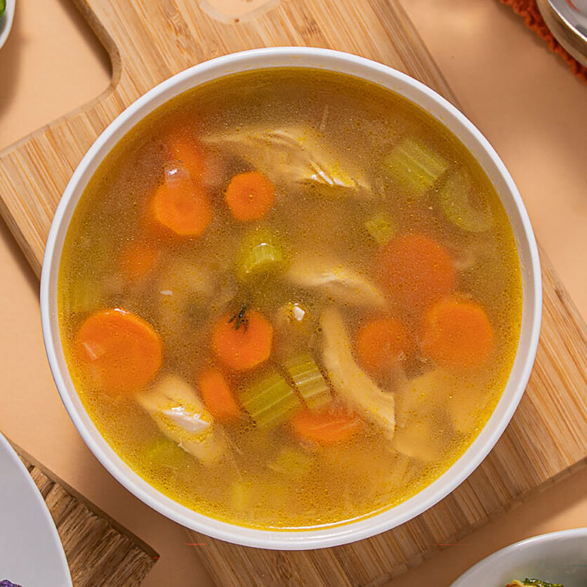 An image of prepared Leftover Turkey Soup made with turkey, thyme, onion, celery, carrot and Pacific Foods® Organic Low Sodium Free Range Chicken Broth.