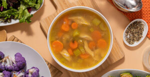 An image of prepared Leftover Turkey Soup made with turkey, thyme, onion, celery, carrot and Pacific Foods® Organic Low Sodium Free Range Chicken Broth.