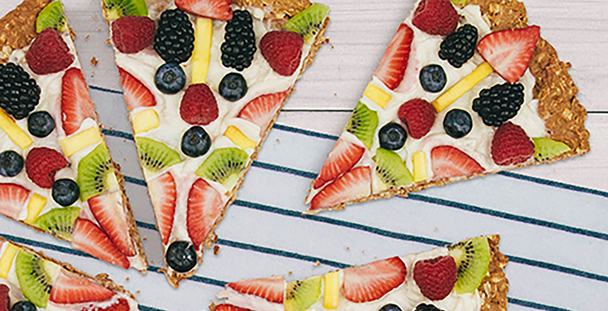 An image of prepared Fruit Pizza made with oats, Pacific Foods® Organic Oat Original Beverage, cream cheese and mixed berries.